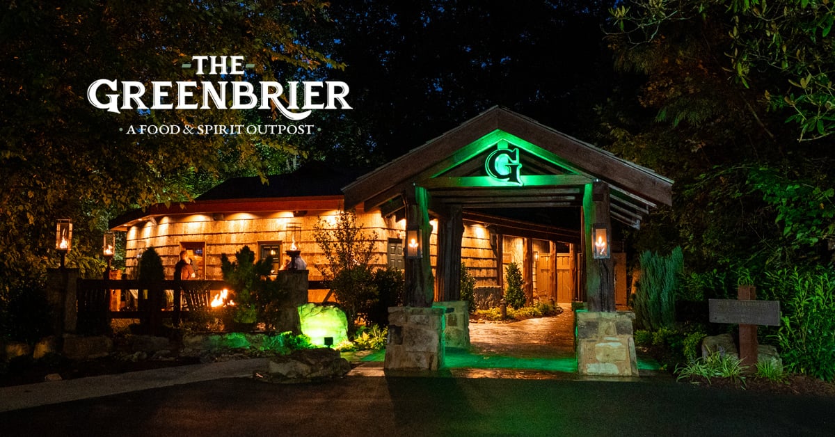 Log and timber exterior of The Greenbrier Restaurant at 370 Newman Road in Gatlinburg, Tennessee, surrounded by Smoky Mountain forest
