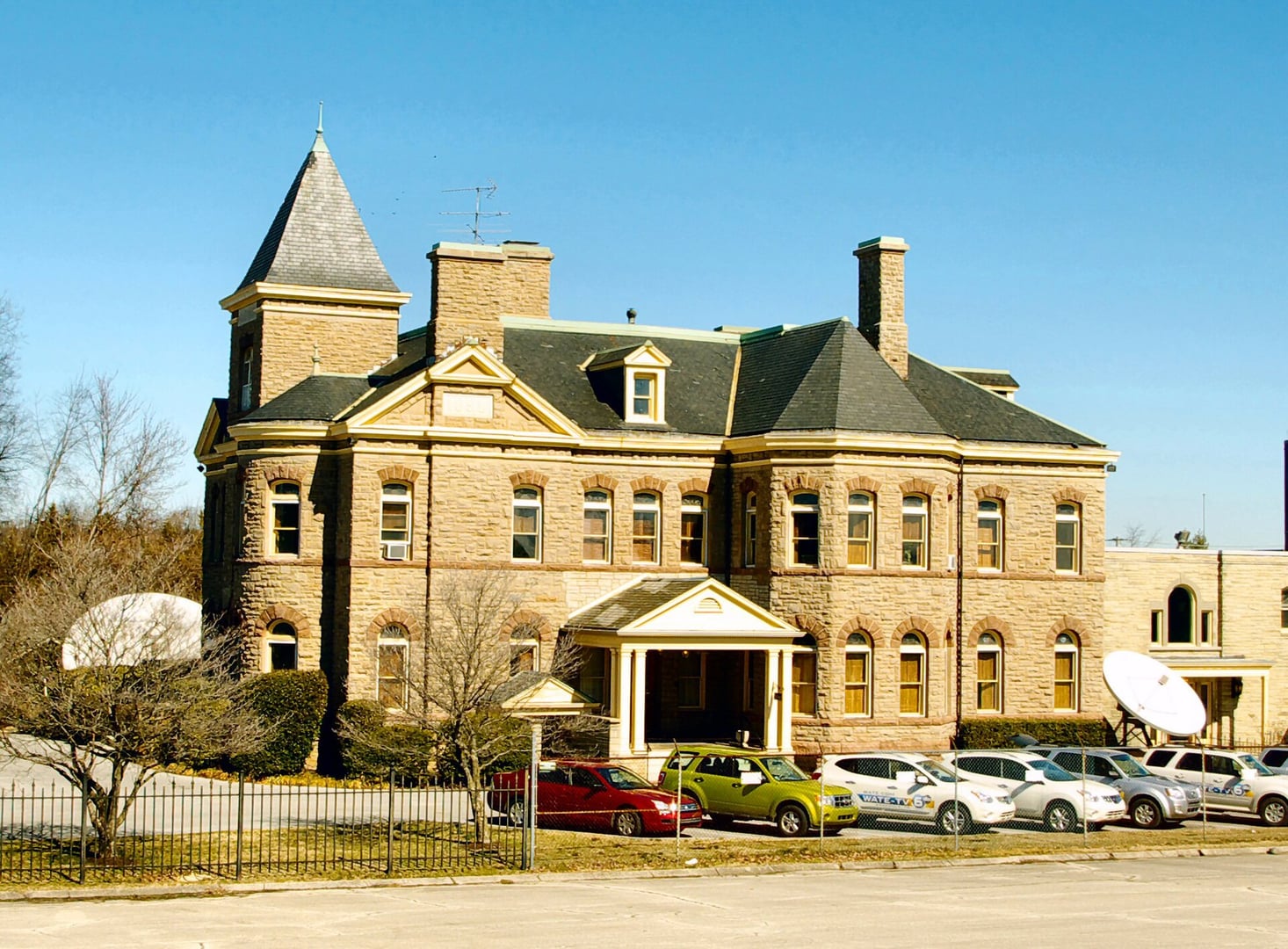 Rusticated limestone Romanesque Revival facade of Greystone (1890), Eldad Cicero Camp's mansion at 1306 Broadway in Knoxville, now WATE-TV studios.