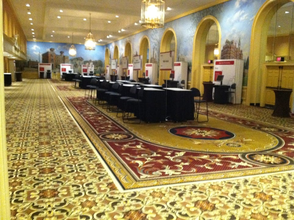Convention hallway at the Gaylord Opryland Resort with a gold-mosaic patterned carpet and a painted mural ceiling over the registration desks, 2015.
