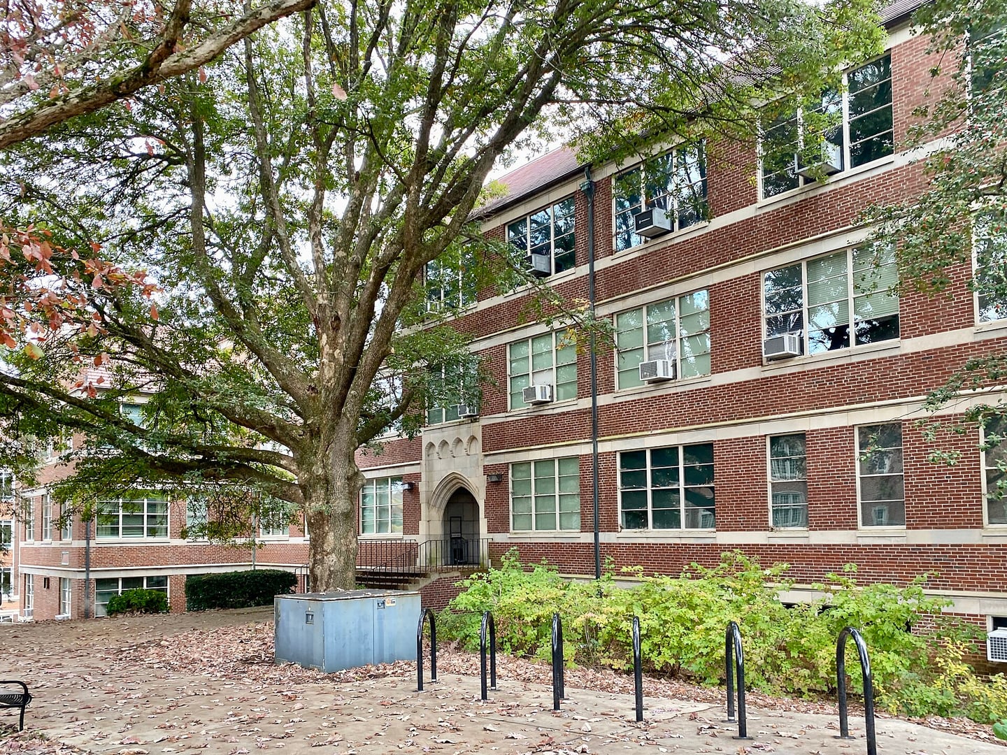 Collegiate Gothic Revival red brick and limestone facade of Perkins Hall (1949) at the University of Tennessee in Knoxville's Fort Sanders neighborhood.