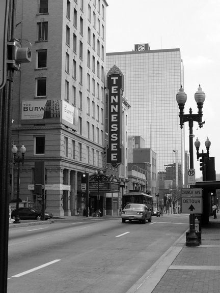 Vertical marquee blade sign and ornate facade of the Tennessee Theatre (1928), a Knoxville movie palace at 604 South Gay Street.