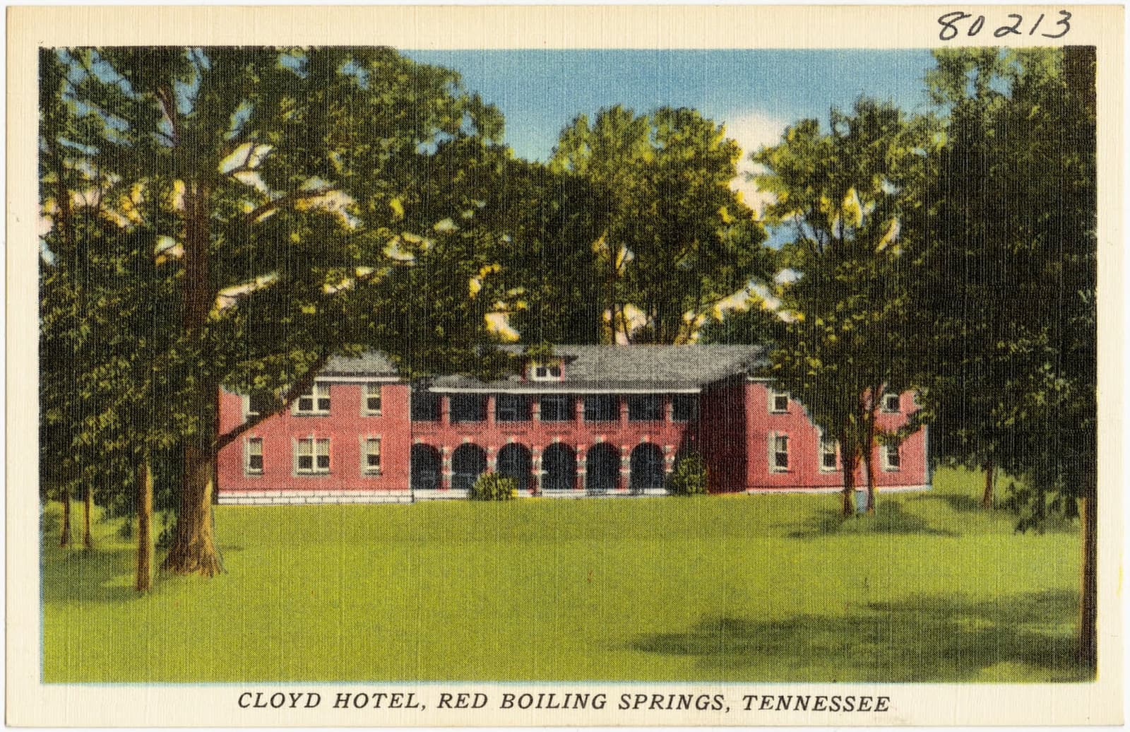 White weatherboard facade of the Thomas House Hotel with multi-level verandas in Red Boiling Springs, Tennessee