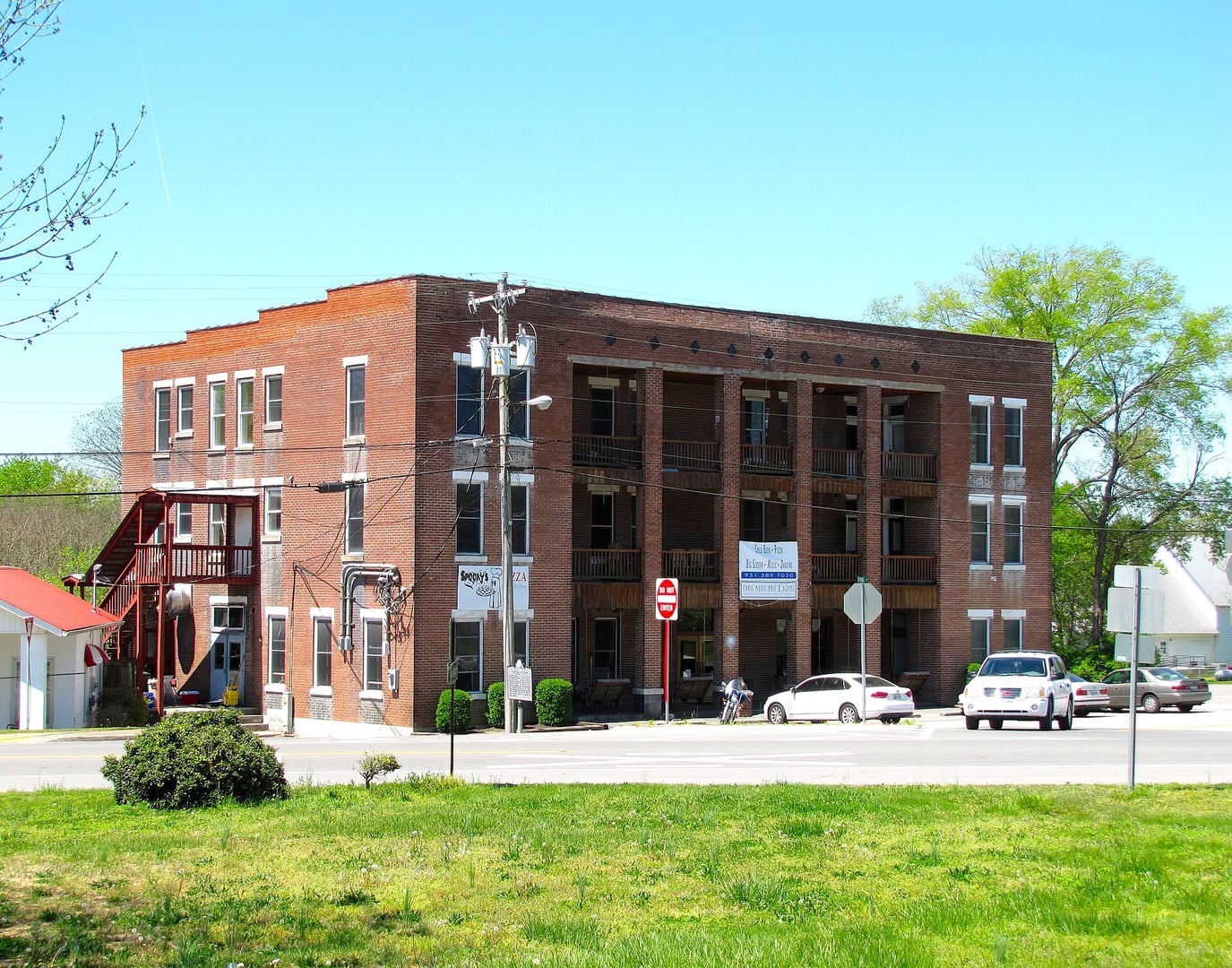 Three-story brick Walking Horse Hotel facade in downtown Wartrace, Tennessee, a National Register railroad hotel built in 1917
