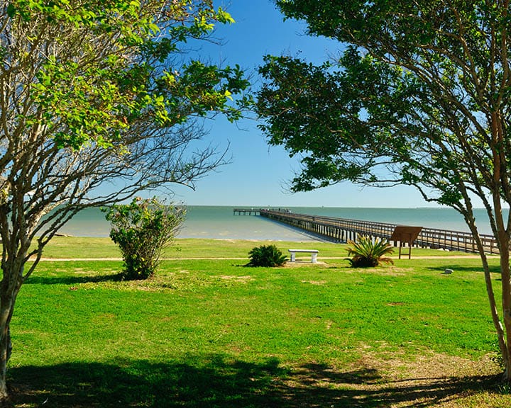 Fishing pier jutting out into Galveston Bay from Pine Gully Park in Seabrook, TX