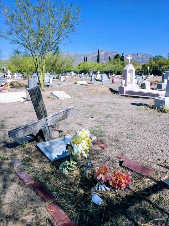 Homemade cross and gravestone at Concordia Cemetery, El Paso.