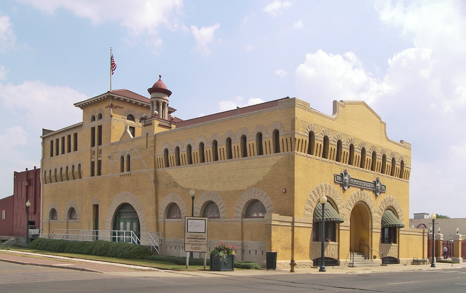 The 1906 Artesian Manufacturing and Bottling Company building in Waco, Texas, now operating as the Dr Pepper Museum — a Romanesque Revival structure with brick facade