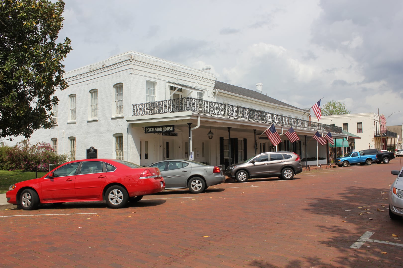 Two-story brick and frame facade of the Excelsior House, the 1858 hotel still operating in Jefferson, Texas