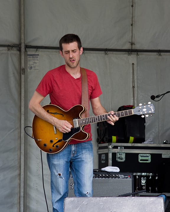 Lead guitar player of Mia Borders' band picking out a blues solo