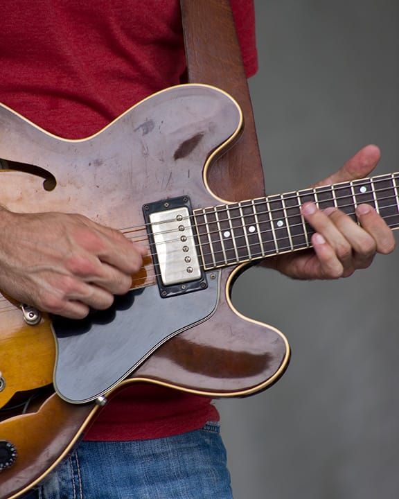 Lead guitar player of Mia Borders' band picking out a blues solo