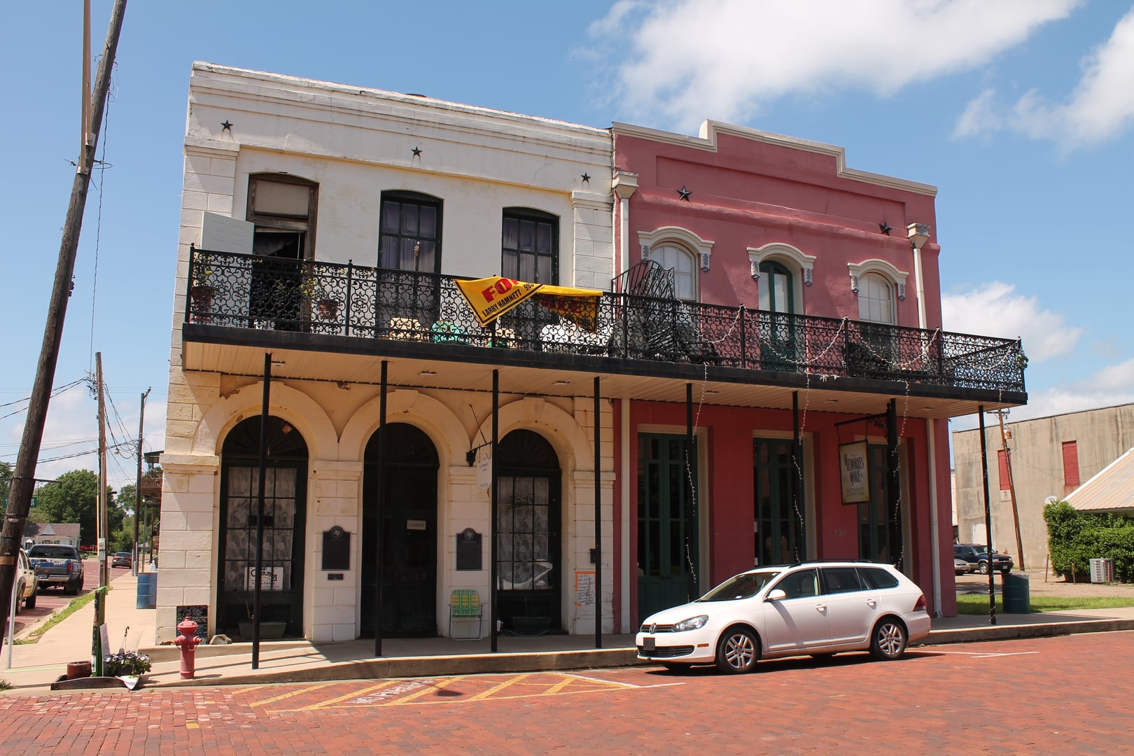 Exterior of the 1865 Kahn Saloon building in Jefferson, Texas, a two-story brick commercial structure in the historic district