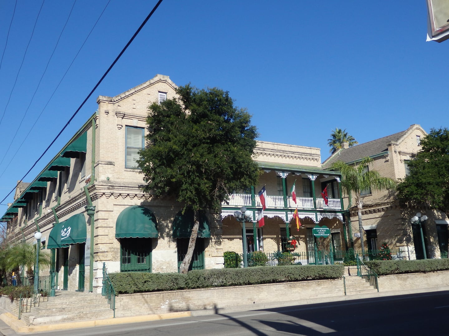 Exterior of the La Borde House historic hotel in Rio Grande City, Texas, showing the two-story 1899 French-influenced building