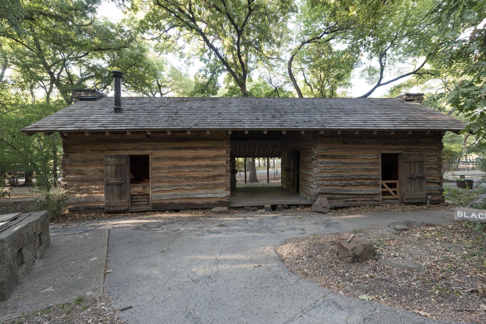 The Parker Cabin at Log Cabin Village in Fort Worth, Texas, a historic double log cabin originally built around 1848 and moved to the museum campus