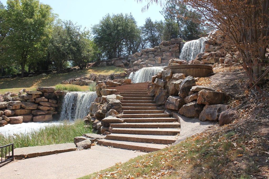 The 'Little Sister' marble statue of Flora Kemp at Riverside Cemetery in Wichita Falls, Texas, depicting a young girl descending a staircase