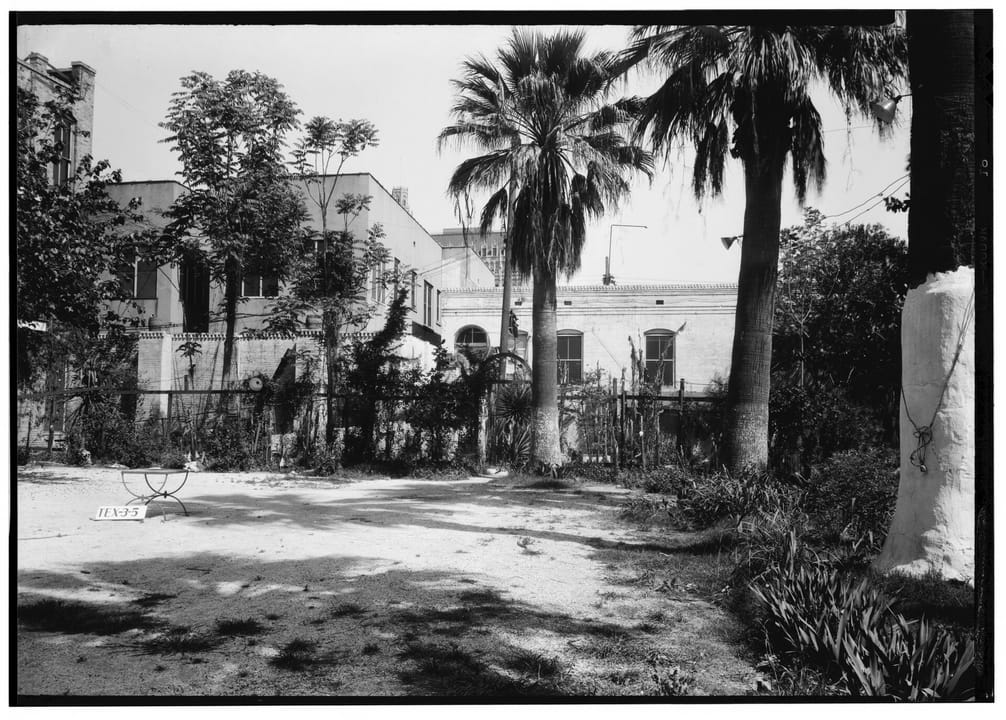 The Menger Hotel's rear courtyard, north elevation, photographed for the Historic American Buildings Survey, April 1, 1936.