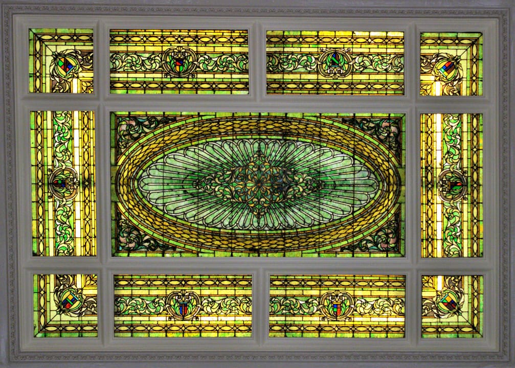 The leaded stained-glass skylight in the Menger Hotel's Neoclassical lobby, added in the 1909 remodel by Alfred Giles.