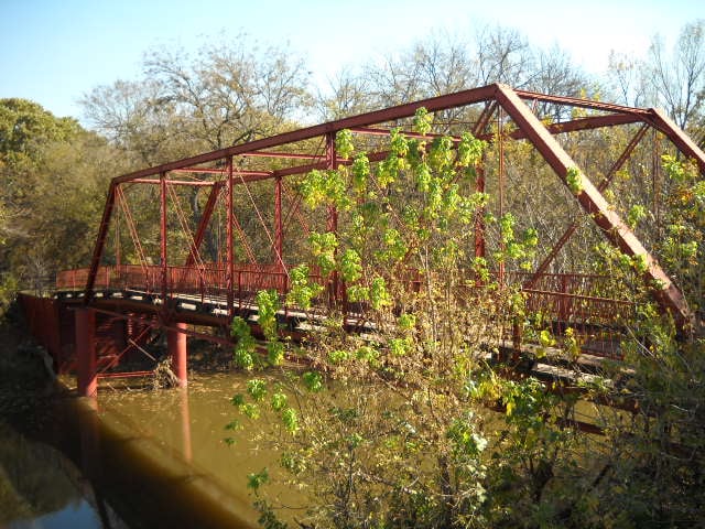 The 1884 iron truss Old Alton Bridge over Hickory Creek near Denton, Texas, known as Goatman's Bridge