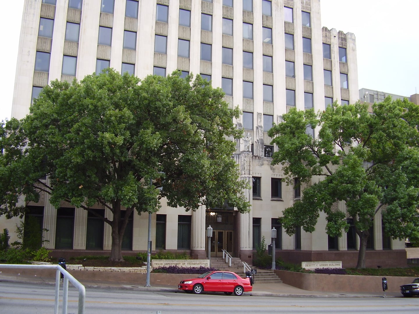 The Dewitt C. Greer State Highway Building at 11th and Brazos Streets in Austin, Texas — built in 1933 on the site of the 1876 Travis County Jail where nine men were hanged