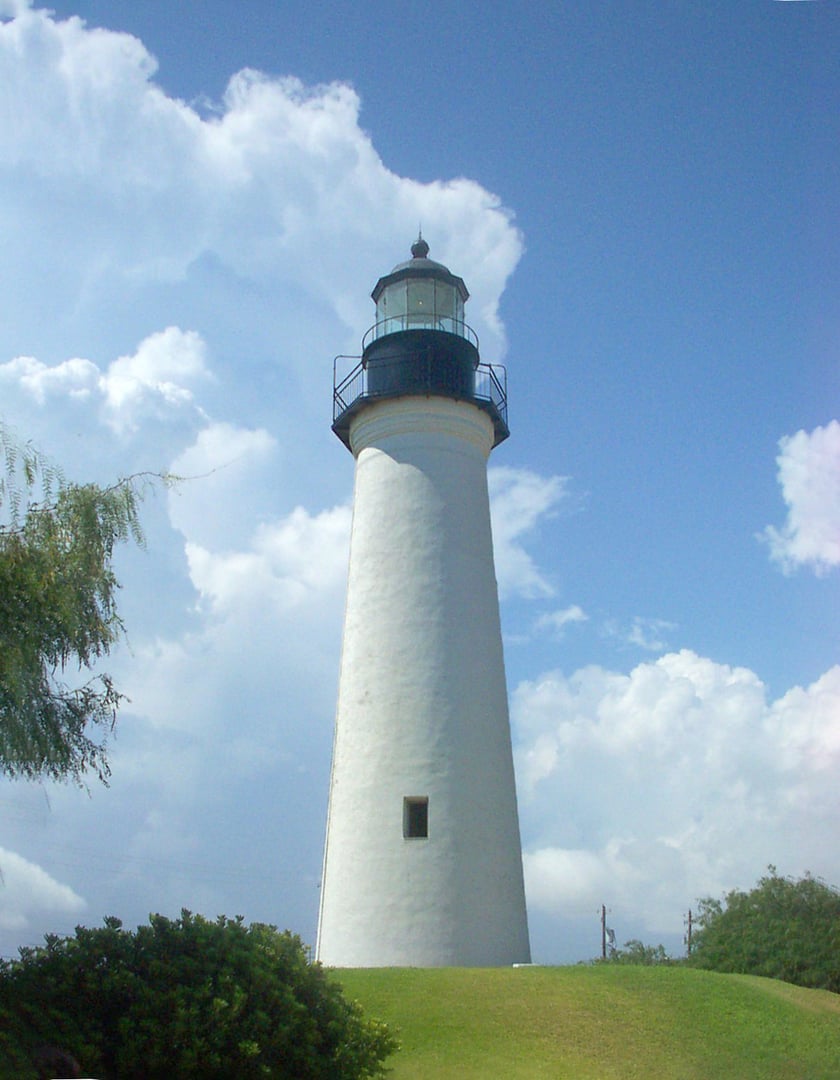 The white 1852 Port Isabel Lighthouse tower against South Texas sky, a State Historic Site in Cameron County near Brownsville
