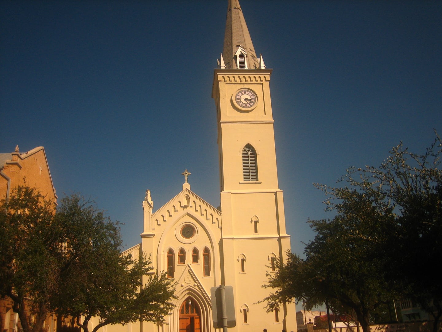 Exterior facade of San Agustín Cathedral in Laredo, Texas, featuring its five-story bell and clock tower