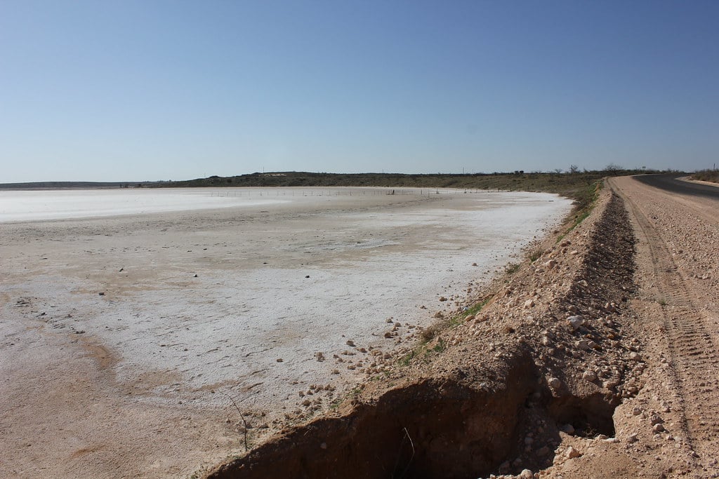 Remaining cemetery and dry alkali lakebed at the Shafter Lake ghost town site north of Andrews, Texas