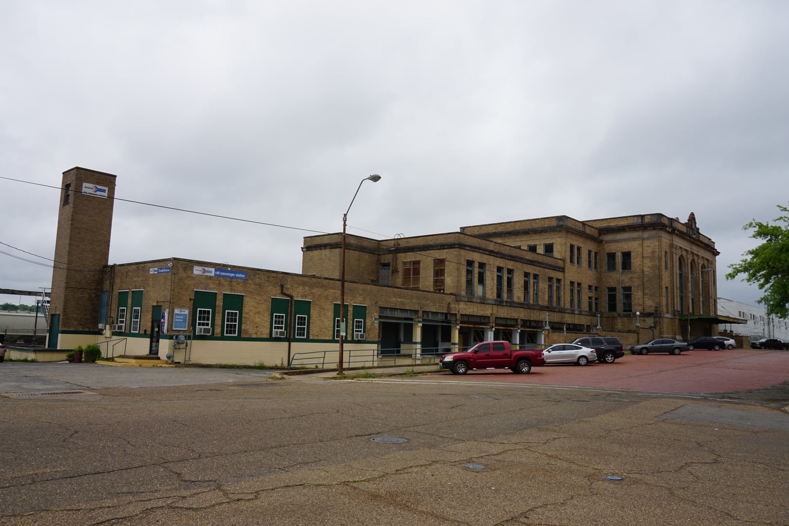 Exterior of Texarkana Union Station showing the 1930 Renaissance Revival facade with arched windows and decorative columns, straddling the Arkansas-Texas state line