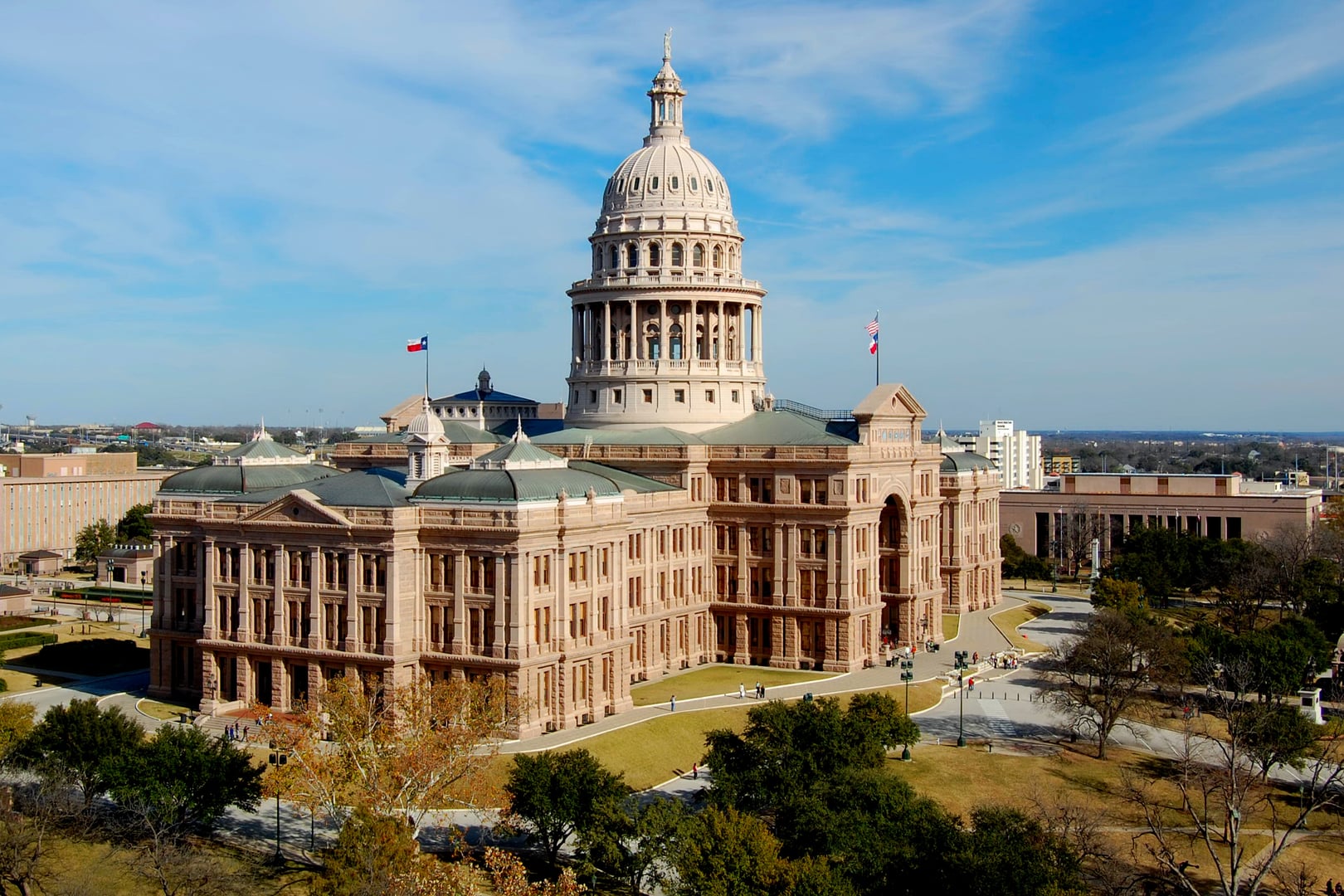 Italian Renaissance Revival pink-granite Texas State Capitol with central dome, downtown Austin