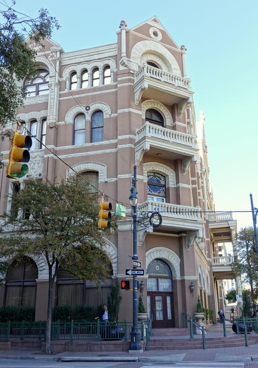 The Driskill hotel exterior in Austin Texas, historic Romanesque Revival brick building on 6th Street