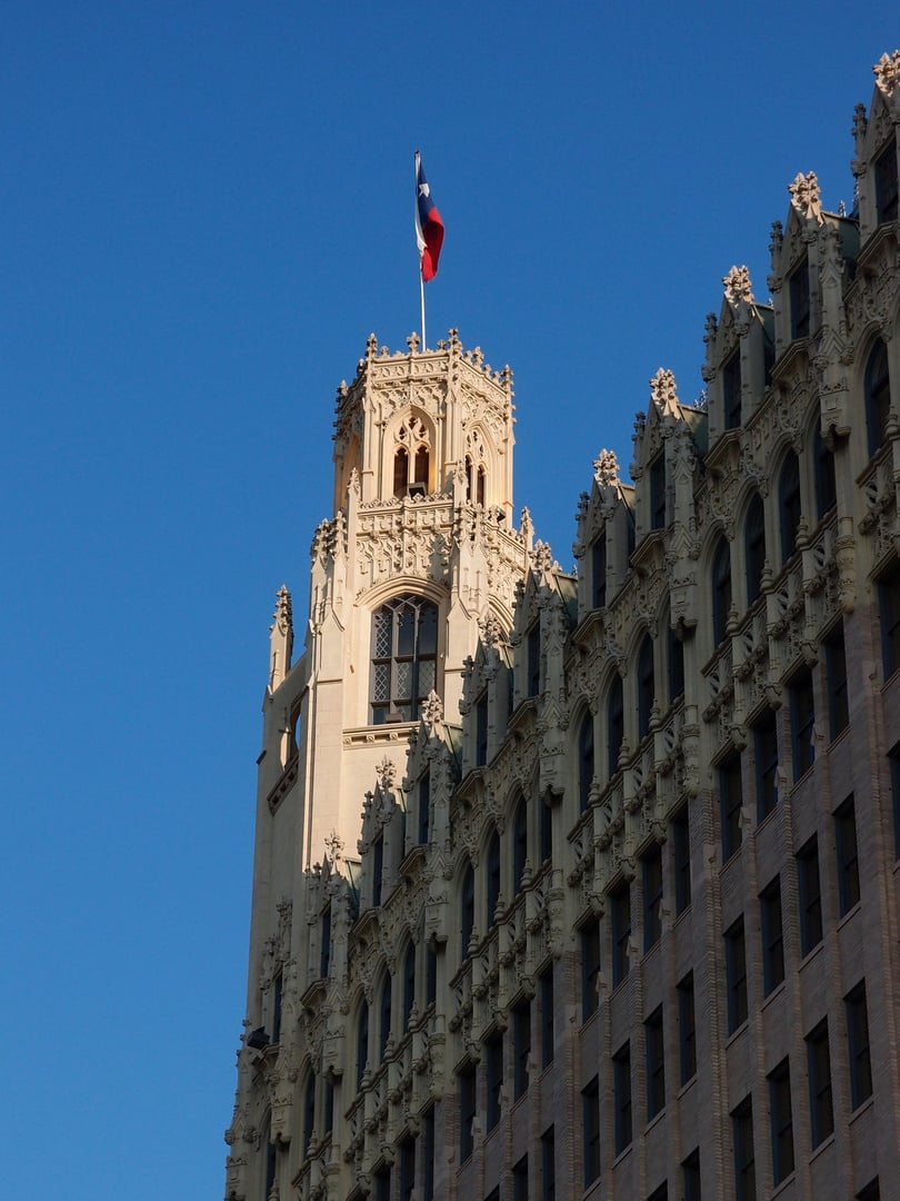 The 13-story Gothic Revival Emily Morgan Hotel tower with gargoyle exterior details, overlooking the Alamo in downtown San Antonio, Texas