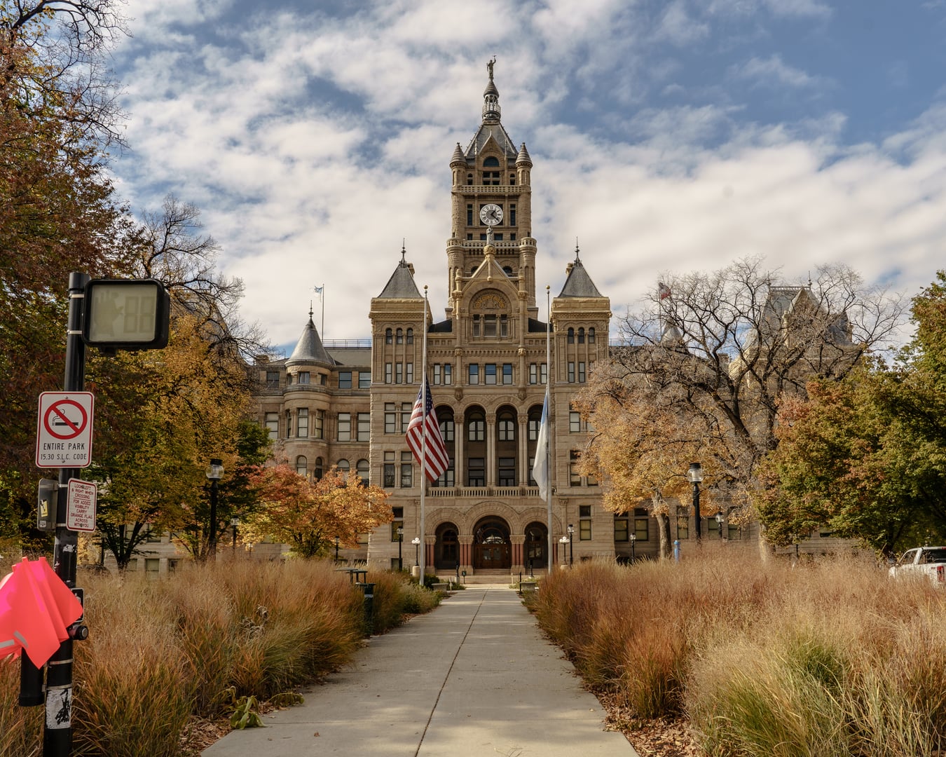 Exterior view of the Salt Lake City and County Building on Washington Square, a Richardsonian Romanesque civic building with a prominent sandstone clock tower