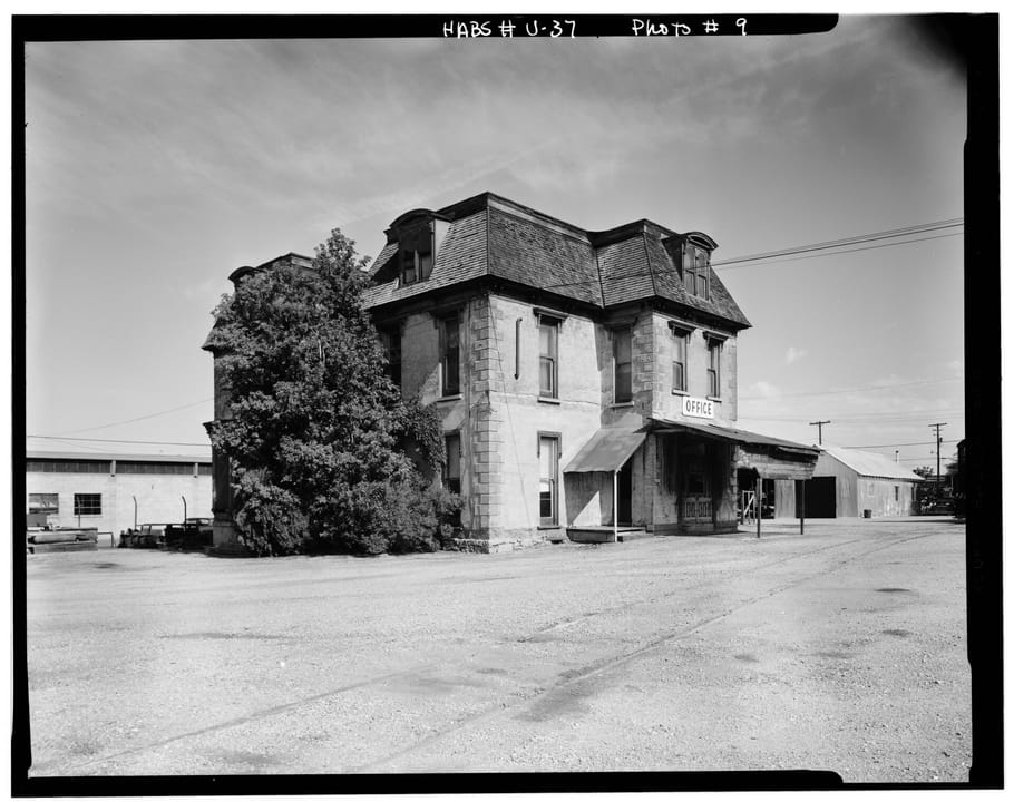The Devereaux Mansion from the southeast in 1967, during a period of industrial/rail-yard use as an office building -- the same dormers and mansard roofline as the current hero.