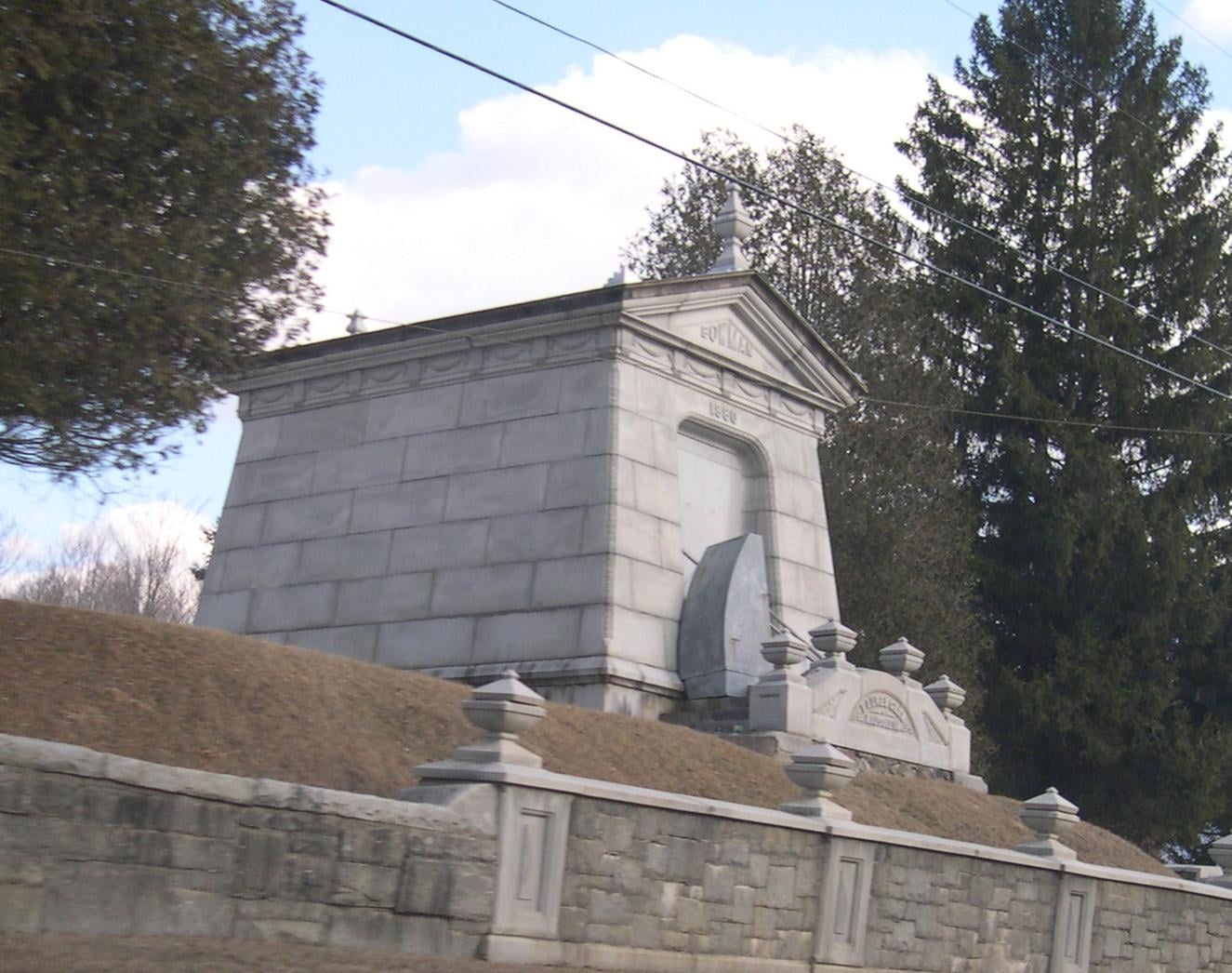 1881 Laurel Glen Mausoleum (Bowman Mausoleum) raised above Route 103 in Cuttingsville, Vermont, with John Bowman's life-size statue at the door