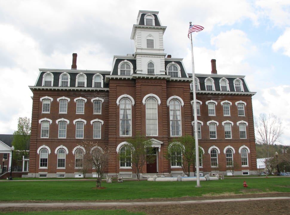 College Hall, Montpelier, Vermont, full frontal view with the flagpole and lawn, May 2008.
