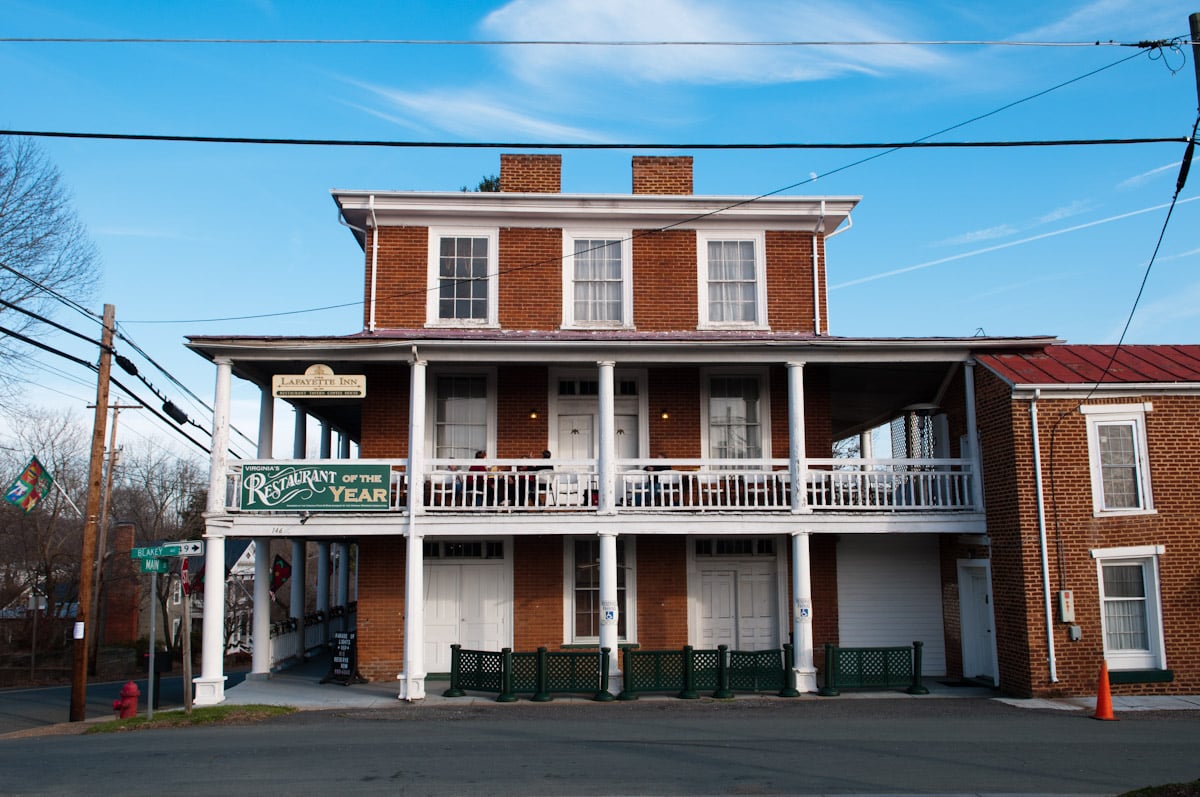 The Lafayette Inn, a historic 1840 brick stagecoach-stop inn on Main Street in Stanardsville, Virginia, viewed from the street
