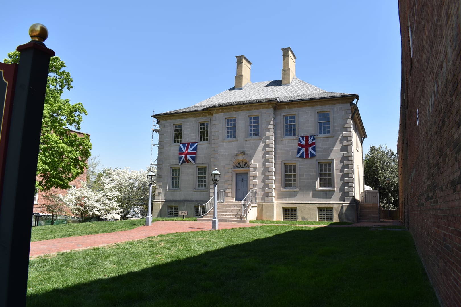 Exterior of the 1753 Carlyle House Georgian sandstone manor at 121 North Fairfax Street in Old Town Alexandria, Virginia