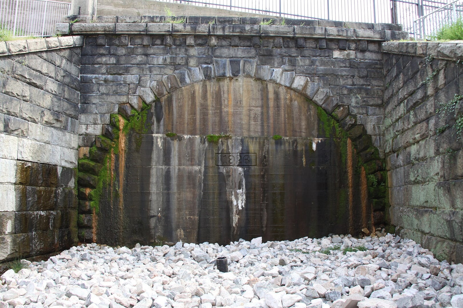 Sealed western portal of the Church Hill Tunnel beneath Jefferson Park, Richmond, Virginia