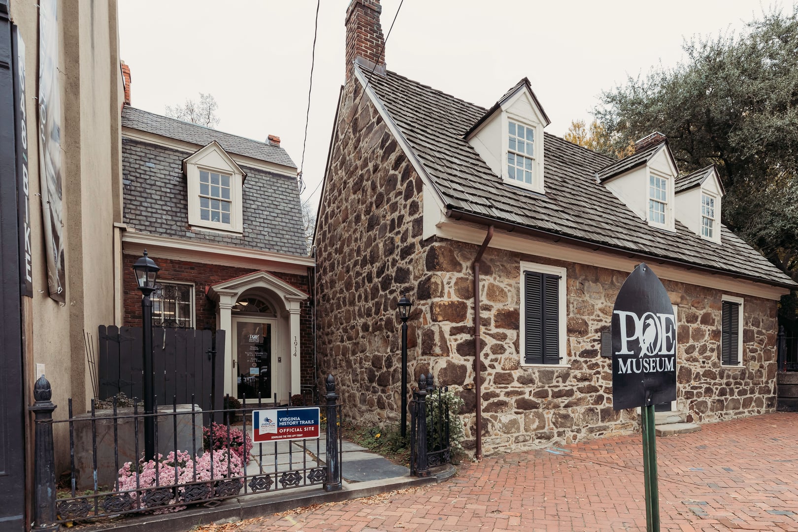 Entrance to the Edgar Allan Poe Museum centered on the c.1740 Old Stone House in Shockoe Bottom, Richmond, Virginia.