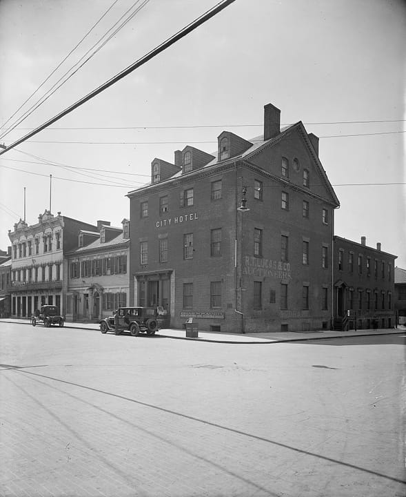 The City Hotel and Gadsby's Inn building on North Royal Street, Alexandria, photographed between 1916 and 1917; a 'CITY HOTEL' sign is visible on the facade.