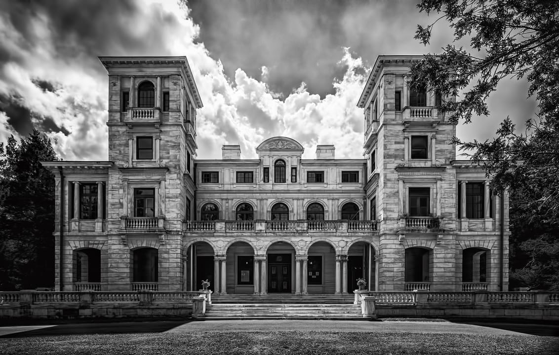 The front facade of Swannanoa, the 1912 marble villa on Afton Mountain, in black and white