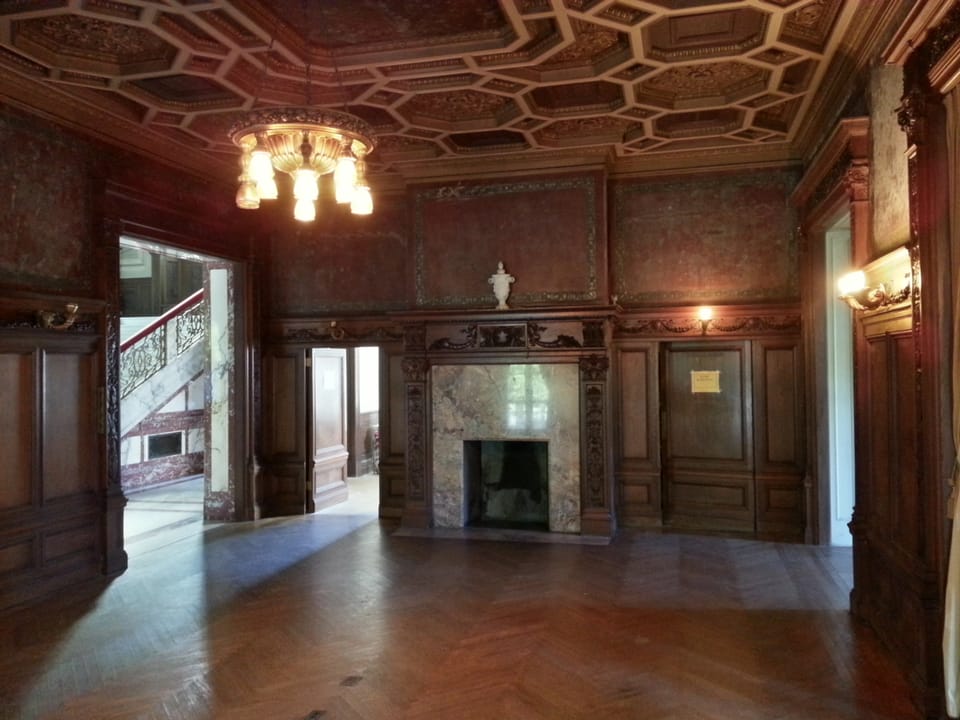 The Florentine-style dining room at Swannanoa, with its carved coffered ceiling