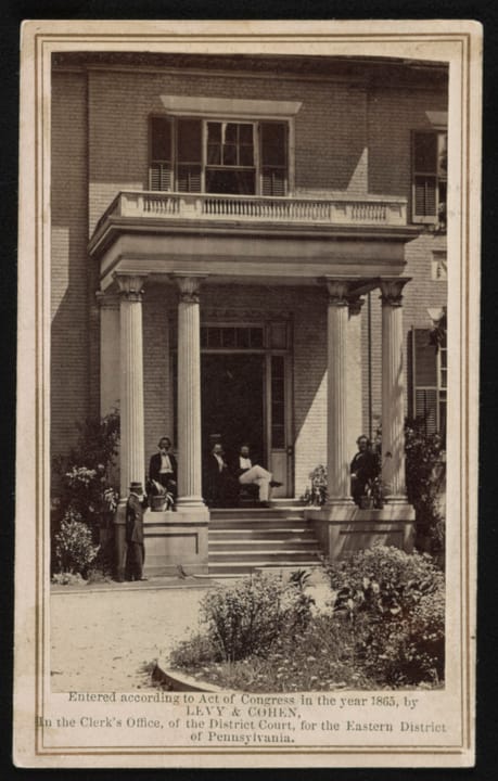 The Executive Mansion's front portico, Richmond, Virginia, 1865: Levy & Cohen carte-de-visite with Governor Francis H. Pierpont and Virginia officials seated on the portico.