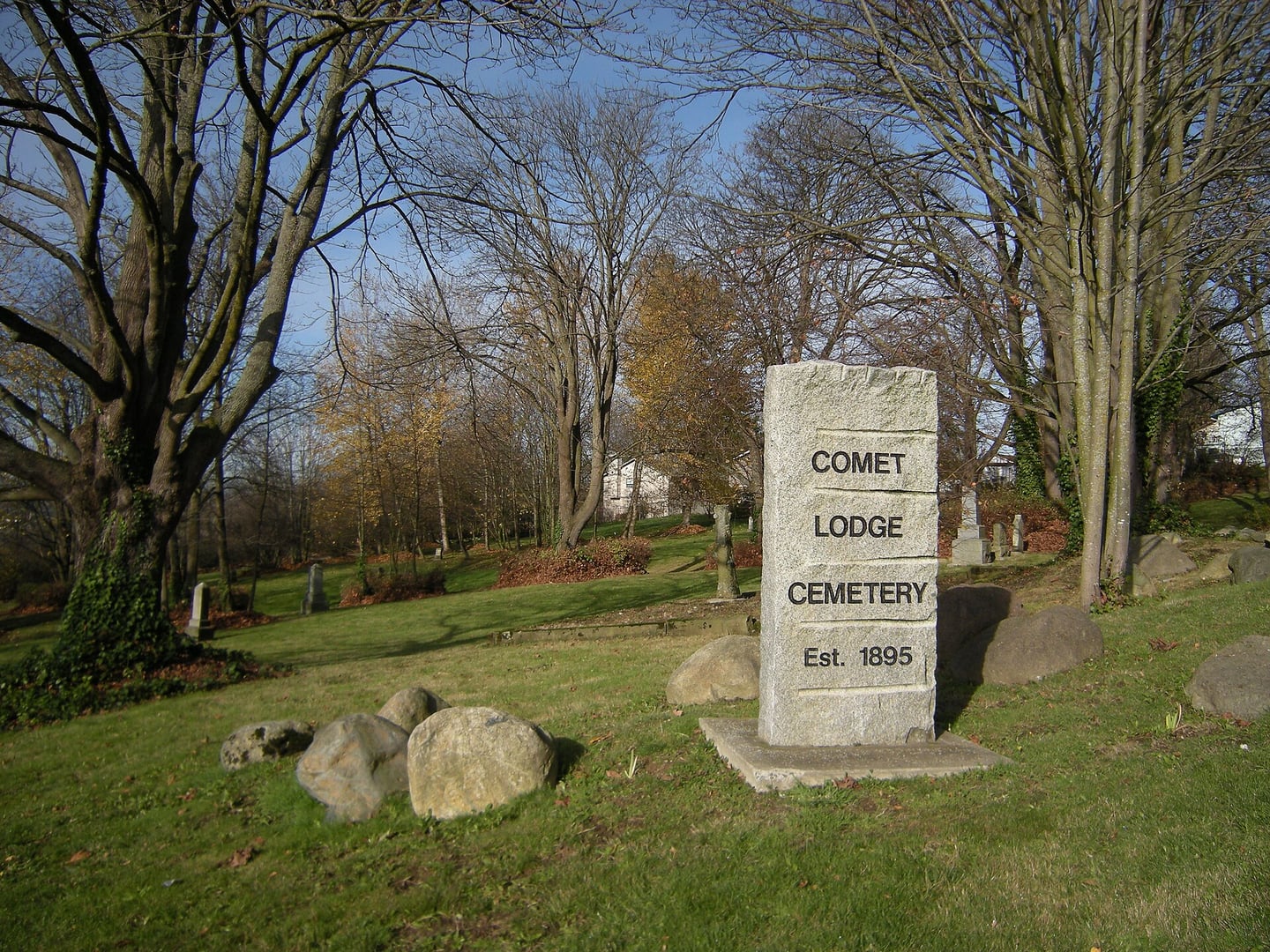 Headstones and grounds of Comet Lodge Cemetery, an 1880s pioneer-era cemetery on Beacon Hill in Seattle, Washington.