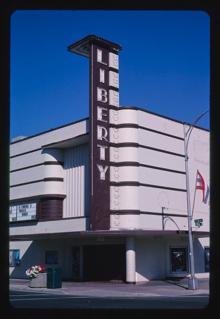 Liberty Theatre, a Streamline Moderne movie house with neon vertical sign, at 5th & Pine in Ellensburg, Washington, photographed by John Margolies in 1987