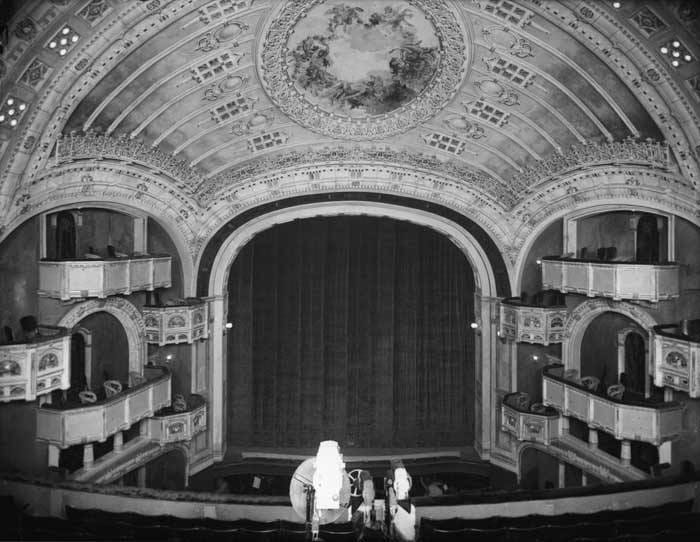 The Moore Theater auditorium seen from the balcony, showing the ceiling decoration, box seats and stage, circa 1910 (Webster & Stevens, Museum of History and Industry).