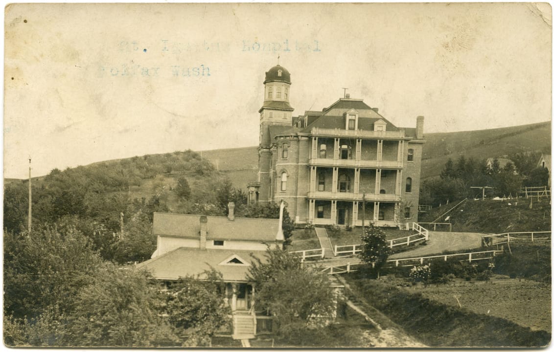 Historic photograph of St. Ignatius Hospital in Colfax, Washington, circa 1900, showing the brick building shortly after construction