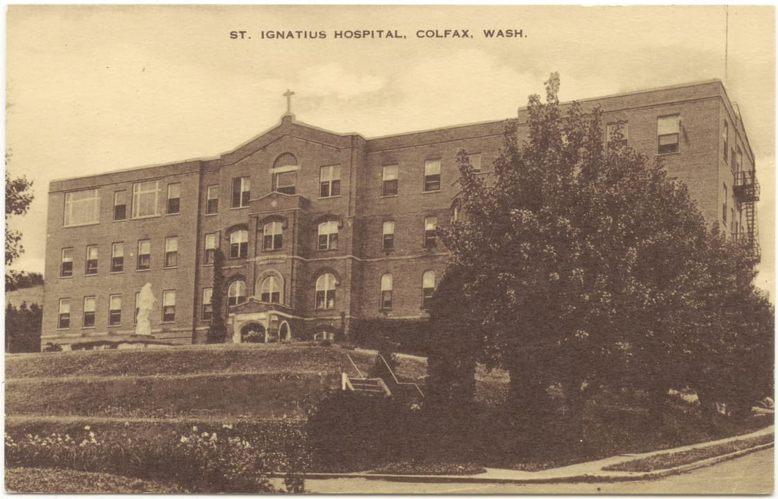 St. Ignatius Hospital in Colfax, Washington, in a 1943 postcard showing the building after the east and west wings and new facade were added