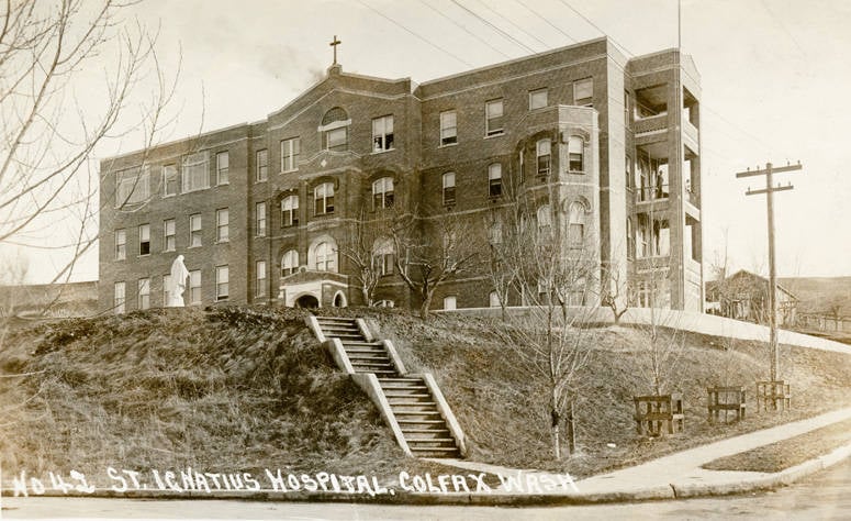 Historic photograph of St. Ignatius Hospital in Colfax, Washington, circa 1900, showing the brick building shortly after construction