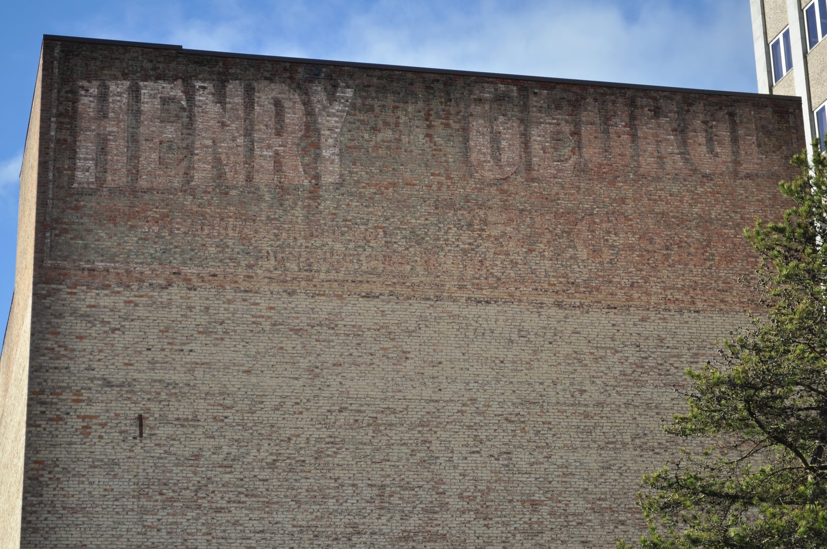 The Historic Everett Theatre exterior brick facade with vintage ghost-sign cigar advertisements, Everett, Washington