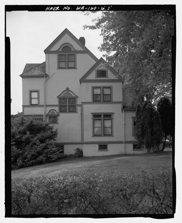 The Walker-Ames House's south-facing gable and front porch, Rainier Avenue, Port Gamble, Washington (HAER WA-160-5).