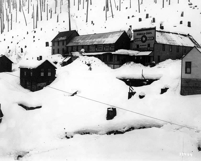 Bailets Hotel and the other buildings of the townsite of Wellington, Washington, buried in deep snow, 1910.
