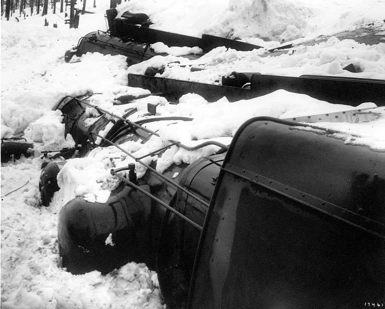Two Great Northern Railway locomotives buried and overturned by the avalanche at Wellington, March 1910.
